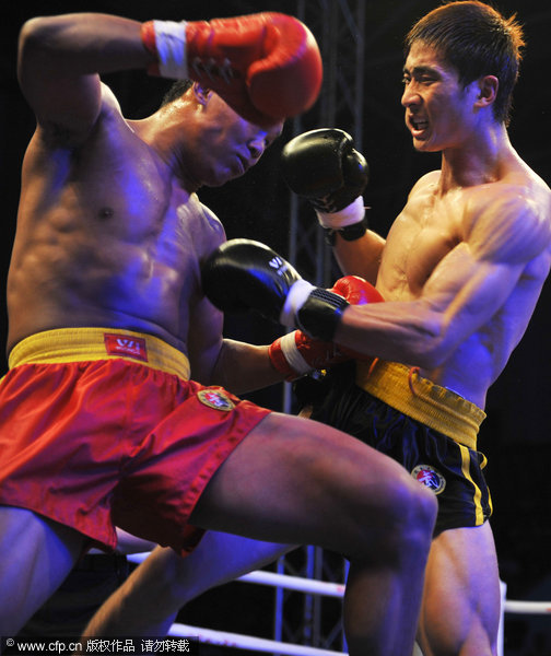 Fighters compete at the 2011 Chinese Sanshou Martial Arts Championship in Haikou, Hainan Province on Tuesday, November 1, 2011.