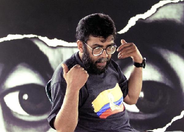 Alfonso Cano, Colombian rebel ideologue and head of the Bolivarian Movement, the newly-launched political organization of the Revolutionary Armed Forces of Colombia, or FARC, gestures during an interview with Reuters in Villa Nora hamlet, near San Vicente del Cagua in this April 30, 2000. [File photo/Xinhua] 