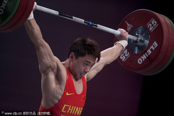 Jjie Zhang from China competes in the men's 62kg category at the World Weightlifting Championships, in Paris on Sunday, Nov. 6, 2011.