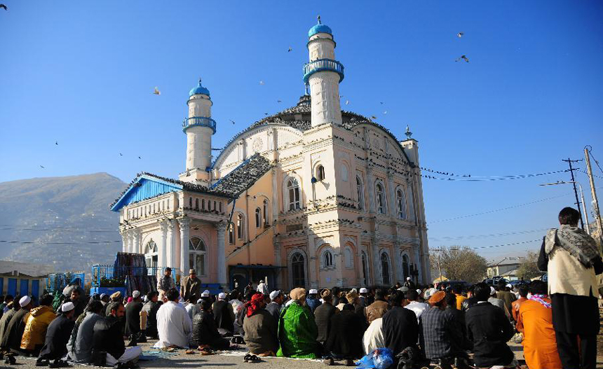 Afghans pray on the first day of the Islamic holiday of Eid al-Adha in Kabul Nov. 6, 2011. Muslims celebrate Eid al-Adha, also known as the Corban Festival which falls on the 10th day of the 12th month of the Islamic calendar, to mark the end of the hajj and commemorate Prophet Abraham's willingness to sacrifice his son Ismail on God's command.