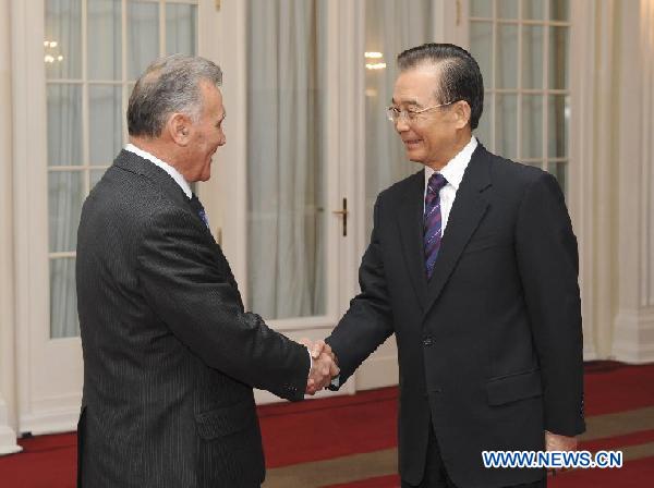 Chinese Premier Wen Jiabao (R) meets with Tajik Prime Minister Akil Akilov attending the 10th Meeting of the Prime Ministers of the Member States of the Shanghai Cooperation Organization (SCO), in St. Petersburg, Russia, Nov. 7, 2011. [Ma Zhancheng/Xinhua]