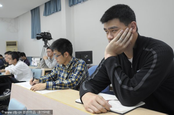 Yao Ming attends class during his first day as a student at Shanghai Jiao Tong University on Monday, Nov.7, 2011.