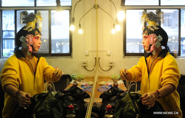 A Japanese amateur Peking Opera actress is seen backstage before a performance in Wuhan, central China's Hubei Province, Nov. 4, 2011. Dozens of Peking Opera fans from China and abroad held a show during the ongoing sixth Peking Opera Festival here Friday. 