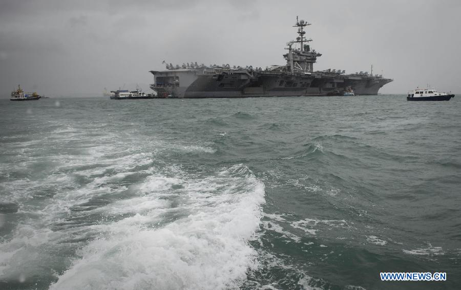 Photo taken on Nov. 9, 2011 shows U.S. aircraft carrier USS George Washington in Hong Kong, south China. The U.S. nuclear powered aircraft carrier USS George Washington pulled in Hong Kong waters on Wednesday to get replenishment upon her second portal call to the city. [Lui Siu Wai/Xinhua]