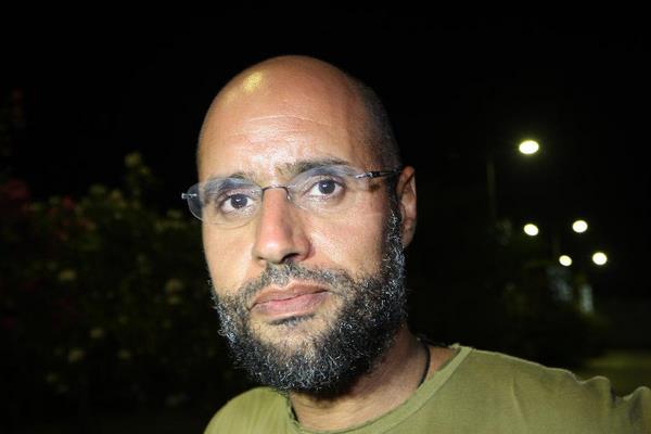 File photo shows Saif al-Islam, the son of Libyan leader Muammar Gaddafi, during an activity in Tripoli on August 23, 2011. Saif al-Islam, promised on August 31, 2011 continued resistance to Libyan forces which ousted his father from Tripoli, and urged Libyans to wage a war of attrition against the National Transitional Council and its NATO backers. [Xinhua/AFP Photo]