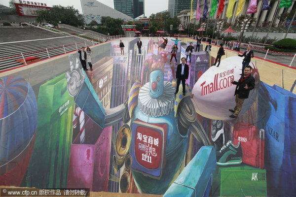 People pose on a 3D picture painted on a square near the Oriental Pearl TV Tower in Shanghai, Nov 9, 2011. The 3D picture covers 1,111 square meters, making it the biggest in China. It is part of an online shopping mall's promotion campaign for a sale that will fall on upcoming 'Single's Day', Nov 11, 2011. [Photo/CFP]