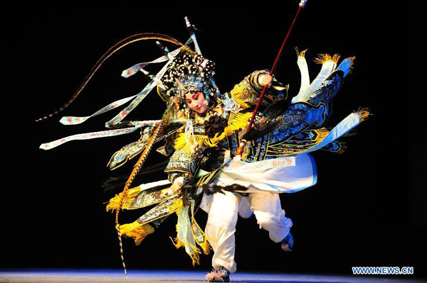 Luan Fen, a member of Qi Shufang Peking Opera Troupe, performs in 'The Women Generals of the Yang Family' during the 6th China Peking Opera Art Festival in Wuhan City, capital of central China's Hubei Province, Nov. 8, 2011. 