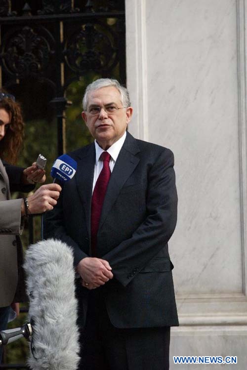 Newly appointed Prime Minister of Greece Lucas Papademos speaks to media outside the Presidential Palace in central Athens, Nov. 10, 2011. Lucas Papademos, a widely-respected economist and former European Central Bank (ECB) vice president, was appointed on Thursday as the prime minister in Greece's new coalition government. [Marios Lolos/Xinhua]