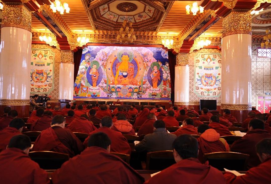 Lama students attend a Buddhism course at school in the Tibet College of Buddhism in Lhasa, capital of southwest China's Tibetan Autonomous Region, Nov. 7, 2011.