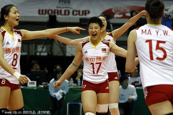 Players of China celebrating victory over South Korea in women's volleyball World Cup on Sunday, Nov. 13, 2011.