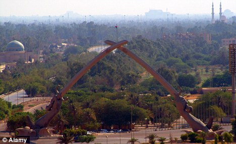 Landmark: The iconic Arc of Triumph depicting crossed swords is one venue that potential tourists in Baghdad could visit.