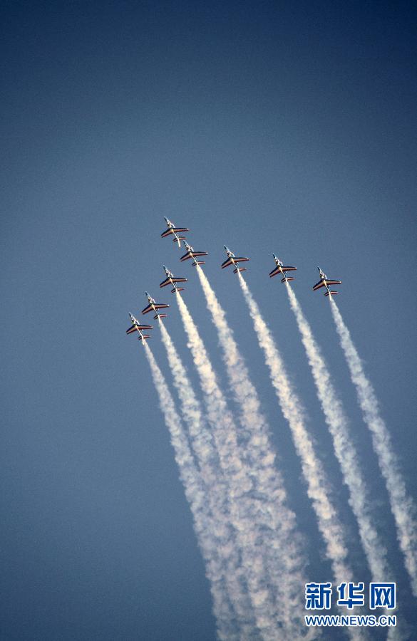 Planes perform during the Dubai International Airshow which kicked off on November 13, 2011. 