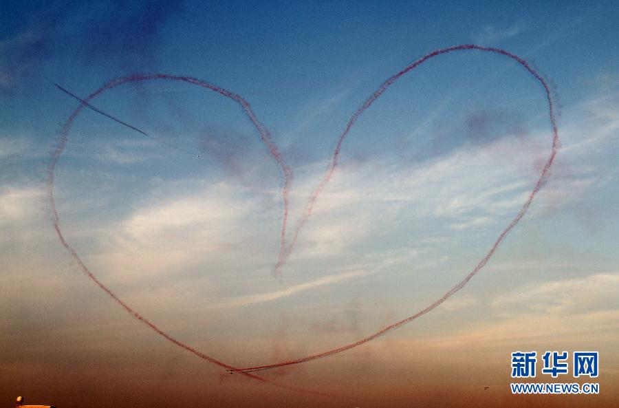 Planes perform during the Dubai International Airshow which kicked off on November 13, 2011. 