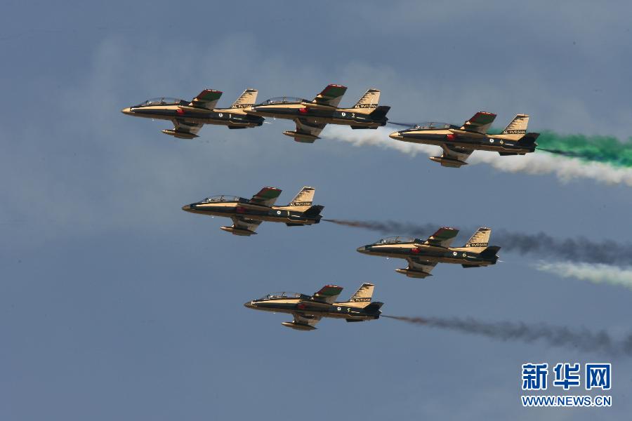 Planes perform during the Dubai International Airshow which kicked off on November 13, 2011. 