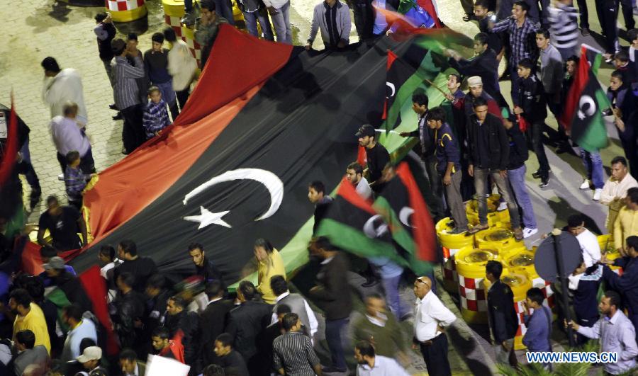 Libyan youths participate in a protest demanding that the Libyan Transitional National Council stop the clashes between fighters from Zawiya and the Warcfana tribe, Tripoli, Libya, Nov. 14, 2011. [Qin Haishi/Xinhua] 