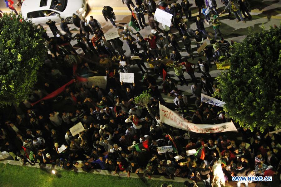 Libyan youths participate in a protest demanding that the Libyan Transitional National Council stop the clashes between fighters from Zawiya and the Warcfana tribe, Tripoli, Libya, Nov. 14, 2011. [Qin Haishi/Xinhua] 