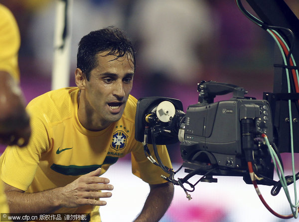 Brazil's Jonas Oliveira celebrates after scoring against Egypt during their international friendly match in Doha, Qatar on Monday Nov. 14, 2011.