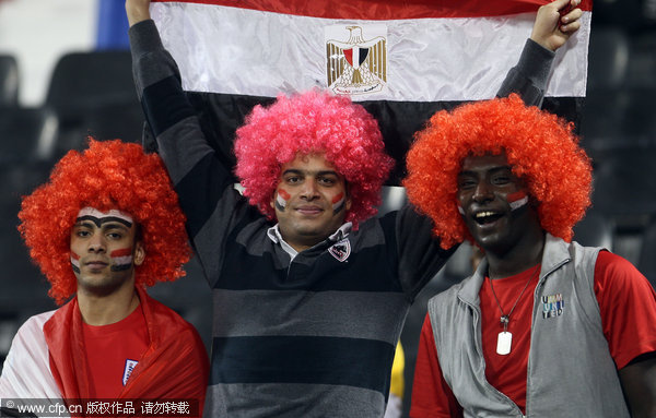 Egyptian fans cheer for their team during their international friendly match in Doha, Qatar on Monday Nov. 14, 2011.