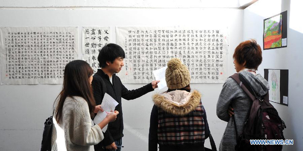 Students visit an exhibition on Chinese culture during Chinese Culture Day Celebration at San Francisco State University in San Francisco, the United States, Nov. 14, 2011.