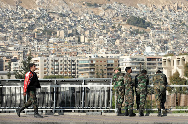 Photo taken on Nov. 11, 2011 shows soldiers guarding in the unrest-torn city of Homs, central Syria. The Syrian government released Tuesday Nov. 15 a total of 1,180 prisoners arrested during the eight-month-long unrest who didn't commit homicide crimes, the state-run SANA news agency reported. [Yin Bogu/Xinhua] 