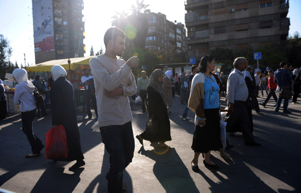 Photo taken on Nov. 2, 2011 shows pedestrians near a market in the capital city of Damascus. The Syrian government released Tuesday Nov. 15 a total of 1,180 prisoners arrested during the eight-month-long unrest who didn't commit homicide crimes, the state-run SANA news agency reported. [Yin Bogu/Xinhua]