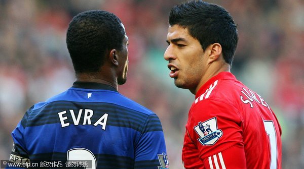 A file picture dated 15 October 2011 shows Liverpool's Luis Suarez (R) and Manchester United captain Patrice Evra (L) during an altercation in their English Premier League soccer match at Anfield in Liverpool, Britain.