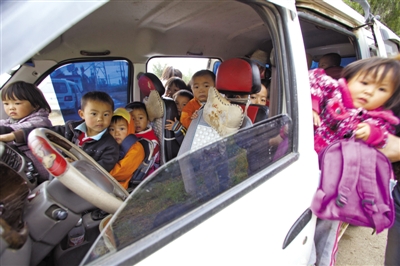 Children are often crammed into buses for their journeys to school in China, especially in rural areas.  