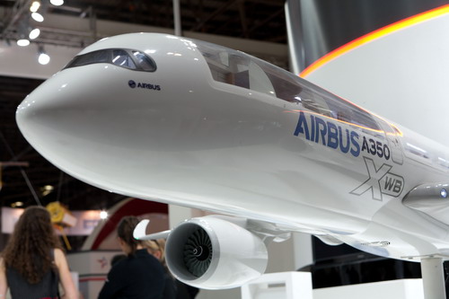 A model of an Airbus SAS A350 XWB on display at an air show. The European aircraft maker opened a logistics center in Tianjin on Friday. [Bloomberg]