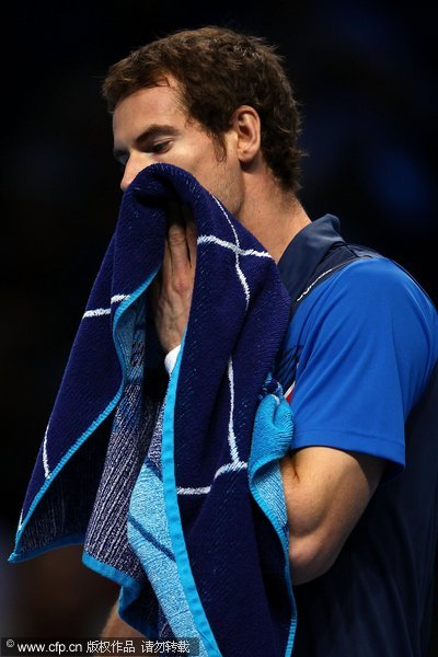  Andy Murray of Great Britain reacts during the men's singles first round match against David Ferrer of Spain to the men's singles first round match against David Ferrer of Spain during the Barclays ATP World Tour Finals at the O2 Arena on November 21, 2011 in London, England. 