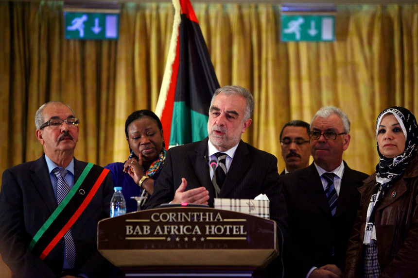 Luis Moreno-Ocampo (4th R), the Chief Prosecutor of the International Criminal Court (ICC), speaks during a joint press conference after meeting with Libya's Interim Justice Minister Mohammed al-Allagui in Tripoli, capital of Libya, on Nov. 23, 2011. Luis Moreno-Ocampo said here Wednesday that Saif al-Islam, the captured son of slain Libyan leader Muammar Gaddafi, will be tried inside Libya. 