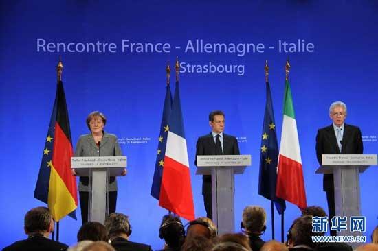 German Chancellor Angela Merkel, left, France&apos;s President Nicolas Sarkozy, center, and Italy&apos;s Prime Minister Mario Monti, right, during a press conference in Strasbourg, eastern France, Thursday, Nov 24, 2011. The leaders of Germany, France and Italy are set for debate on the European Central Bank&apos;s role in the region&apos;s debt crisis and on how to align eurozone economic policies.