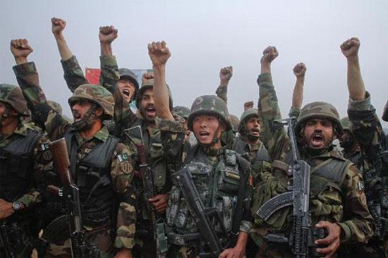 Soldiers from Pakistan and China shout 'Long live China, long live Pakistan' after joint military exercises in Jhelum, in Pakistan's Punjab province, November 24, 2011. Pakistani Army Chief General Ashfaq Kayani on Thursday said that military cooperation between Pakistan and China was not aimed against any country, local media reported. [CNTV]