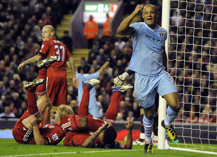 Manchester City's Vincent Kompany (R) celebrates scoring against Liverpool during their English Premier League soccer match in Liverpool, northern England November 27, 2011. (Xinhua/Reuters Photo) 