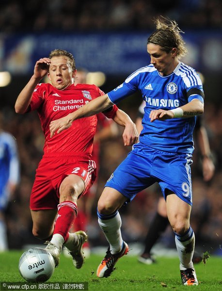 Fernando Torres of Chelsea is challenged by Lucas of Liverpool during the Carling Cup quarter final match between Chelsea and Liverpool at Stamford Bridge on November 29, 2011 in London, England.