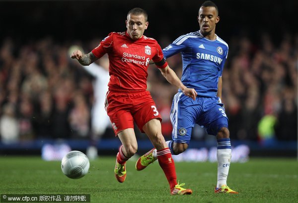 Craig Bellamy of Liverpool is closed down by Ryan Bertrand of Chelsea during the Carling Cup quarter final match between Chelsea and Liverpool at Stamford Bridge on November 29, 2011 in London, England.