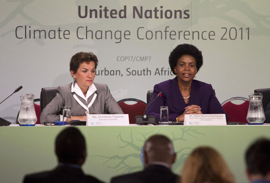 COP 17 President Maite Nkoana-Mashabane speaks during a press conference with Executive Secretary of the United Nations Framework Convention on Climate Change (UNFCCC) Christiana Figueres (L) at the Conference of the Parties (COP17) of the United Nations Climate Change Conference in Durban, November 30, 2011. [Agencies]