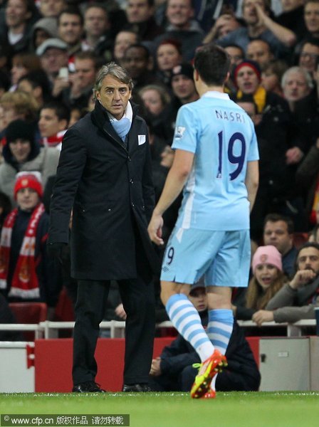  Manchester City's Roberto Mancini with Samir Nasri in Carling Cup quarter final between Arsenal and Manchester City on 29th November, 2011.