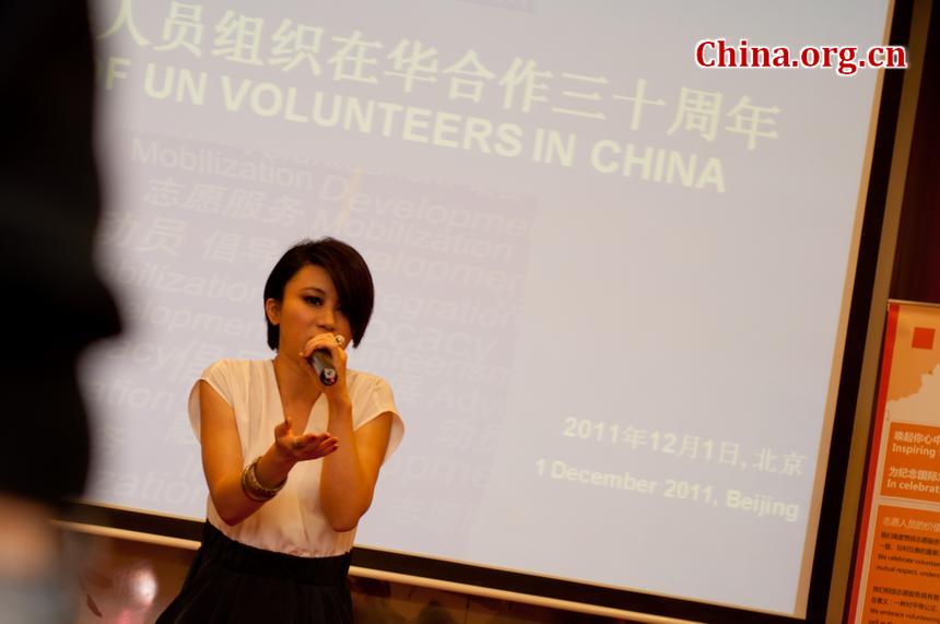 Ms. Shang Wenjie, a Super Girl, sings at the UNV celebration. [Pierre Chen / China.org.cn]