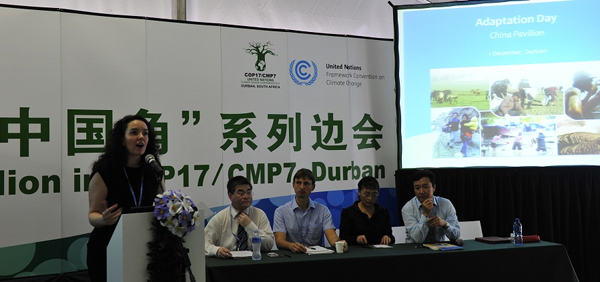 Presenters from China introduces China's achievements and challenges in climate change adaptation on the Adaptation Day activity held in China Pavilion, Durban, December 1, 2011[Yu Yan/China.org.cn]