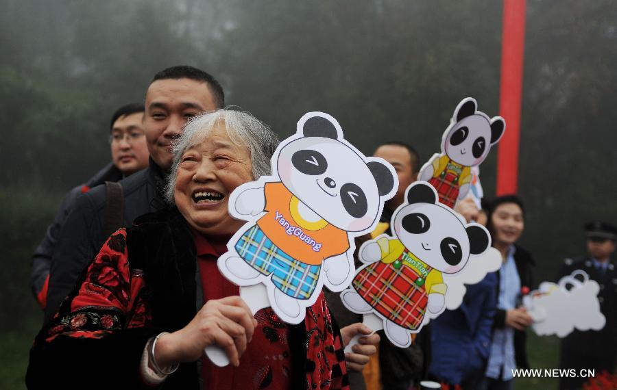 An elderly lady sees off the pandas in Ya'an, southwest China's Sichuan Province, Dec. 3, 2011. As part of a ten-year joint research program, Tian Tian and Yang Guang, the pair of giant pandas, were set off for the Edinburgh Zoo from the Giant Panda Conservation and Research Center in Sichuan here on Saturday. 