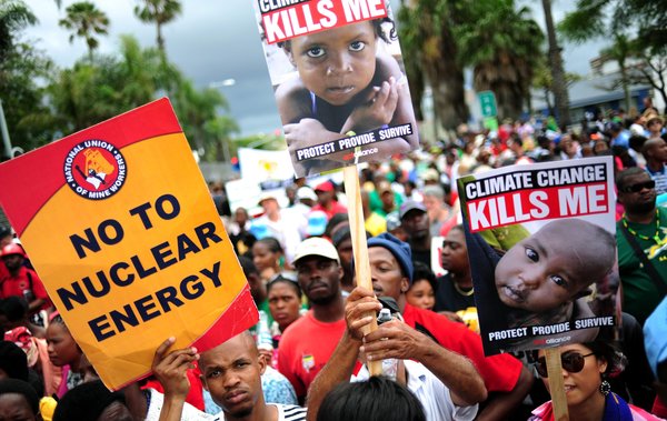 A handout photograph provided by Greenpeace shows some of the thousands of people marching to the ICC during the mass protest in Durban, South Africa, December 3, 2011. The protest is part of the 17th Conference of Parties of the United Nations Framework Convention on Climate Change (COP 17) which continues this week. [CFP]