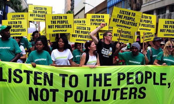 A handout photograph provided by Greenpeace shows some of the thousands of people marching to the ICC during the mass protest in Durban, South Africa, December 3, 2011. The protest is part of the 17th Conference of Parties of the United Nations Framework Convention on Climate Change (COP 17) which continues this week. [CFP]