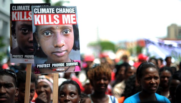 A handout photograph provided by Greenpeace shows some of the thousands of people marching to the ICC during the mass protest in Durban, South Africa, December 3, 2011. The protest is part of the 17th Conference of Parties of the United Nations Framework Convention on Climate Change (COP 17) which continues this week. [CFP]