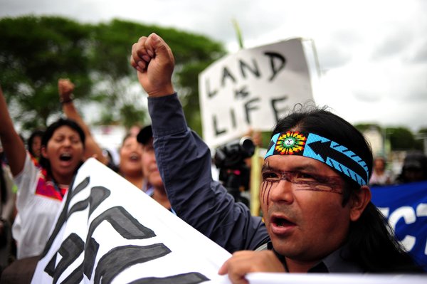 A handout photograph provided by Greenpeace shows some of the thousands of people marching to the ICC during the mass protest in Durban, South Africa, December 3, 2011. The protest is part of the 17th Conference of Parties of the United Nations Framework Convention on Climate Change (COP 17) which continues this week. [CFP]