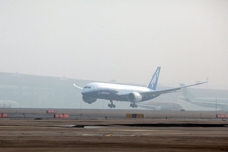 A Boeing 787 Dreamliner lands on the Beijing Capital International Airport, Beijing, China, Dec. 4, 2011. The Boeing 787 Dreamliner arrived here Sunday, kicking off its six-month tour exhibition worldwide. [Yang Le/Xinhua]