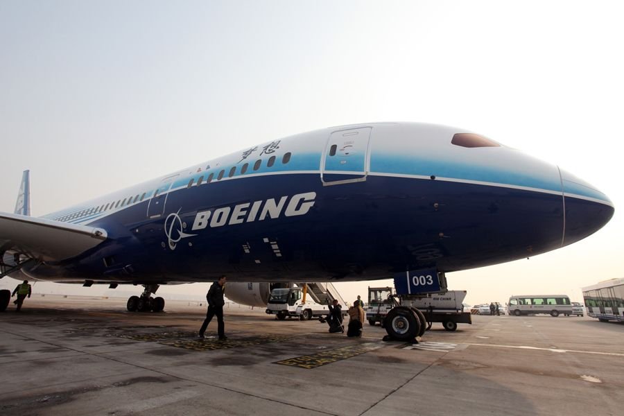 A Boeing 787 Dreamliner is seen parking at the tarmac of the Beijing Capital International Airport, Beijing, China, Dec. 4, 2011. The Boeing 787 Dreamliner arrived here Sunday, kicking off its six-month tour exhibition worldwide. [Yang Le/Xinhua]