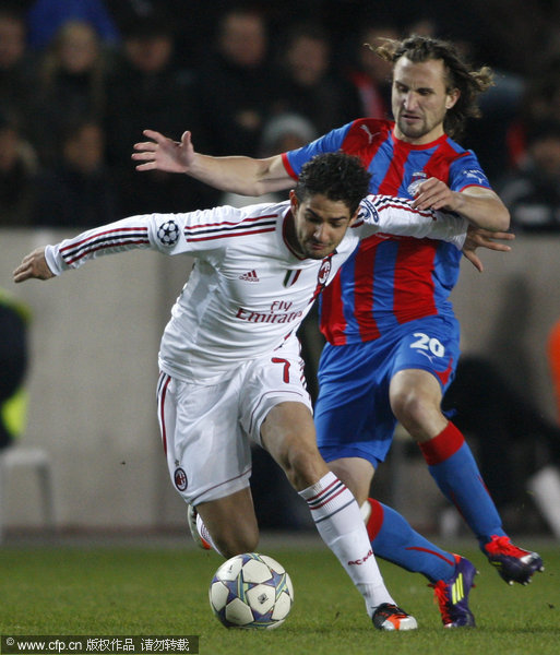  Petr Jiracek (right) of Plzen challenges for a ball with Pato (left) of AC Milan during their UEFA Champions League group H soccer match at Synot Tip Arena, in Prague, Czech Republic, on December 6, 2011.