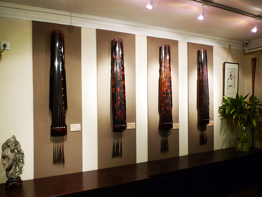 An exhibition on seven-string zithers is on display in Duyi Zither Club in Beijing from November 20 to December 20, 2011. [Photo by Xu Lin / China.org.cn]