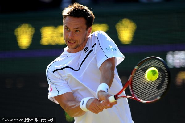 Robin Soderling of Sweden returns a shot during his third round match against Bernard Tomic of Australia on Day Six of the Wimbledon Lawn Tennis Championships at the All England Lawn Tennis and Croquet Club on June 25, 2011 in London, England. 