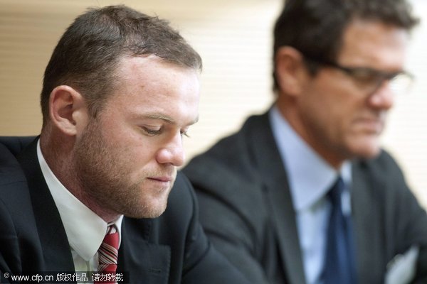 Manchester United's and England national team soccer player Wayne Rooney, (L) and England's national team head coach Fabio Capello, (R) attend the UEFA disciplinary Appeals Body hearing at the UEFA Headquarters, in Nyon, Switzerland, 08 December 2011. 